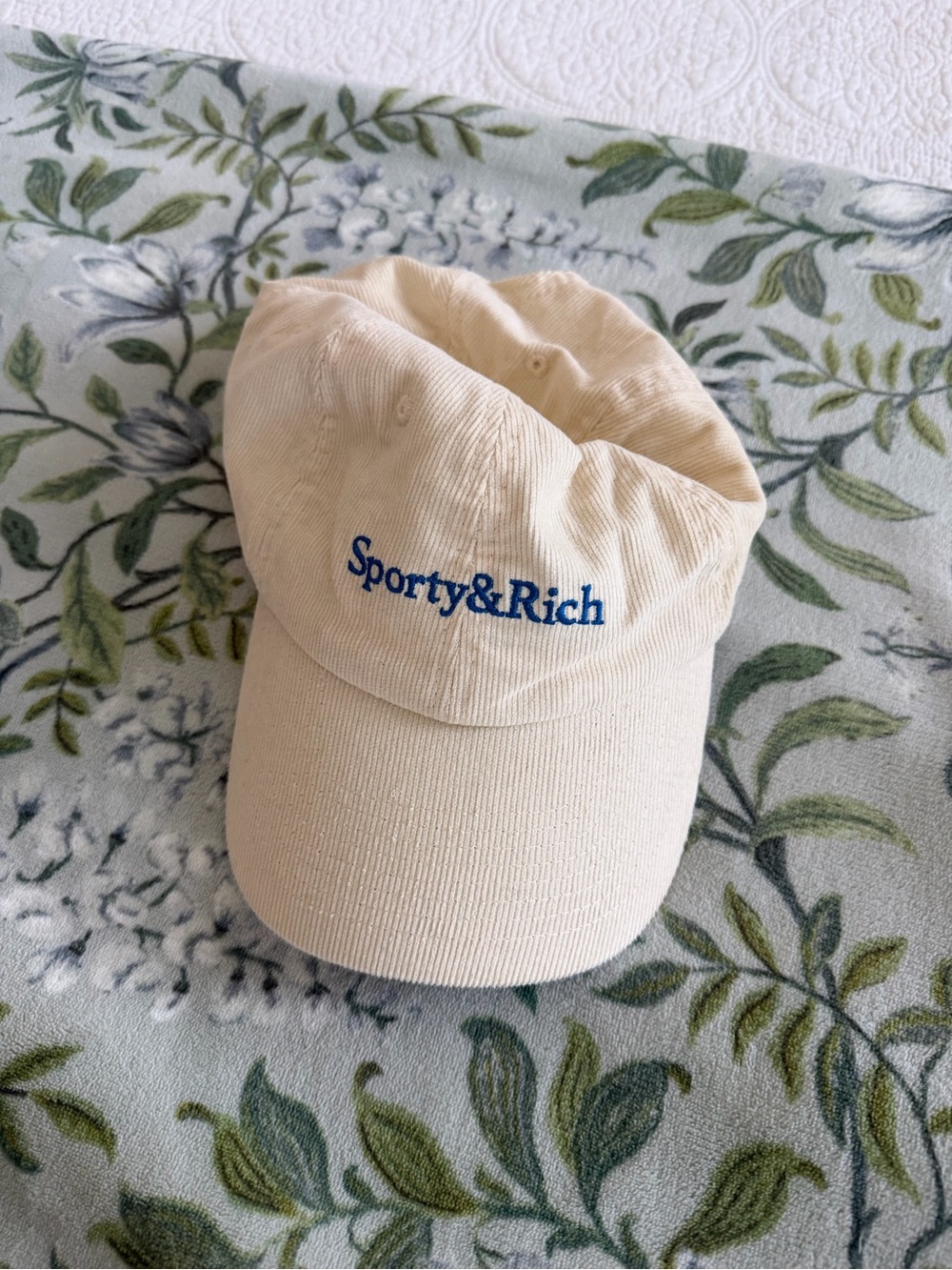 Sporty & Rich Cream Baseball Cap with Blue Logo